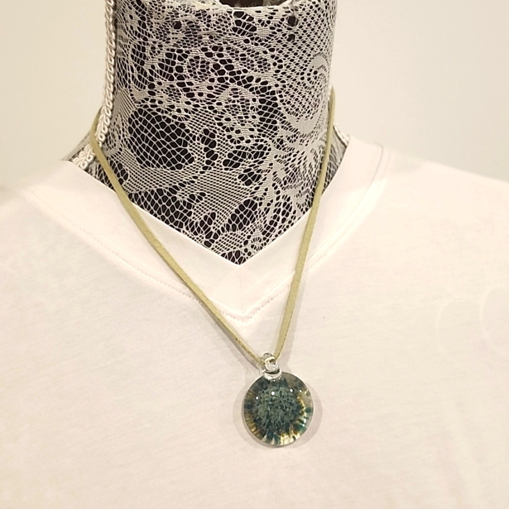 Artisian handmade glass necklace piece with leather band and sliver clasp.